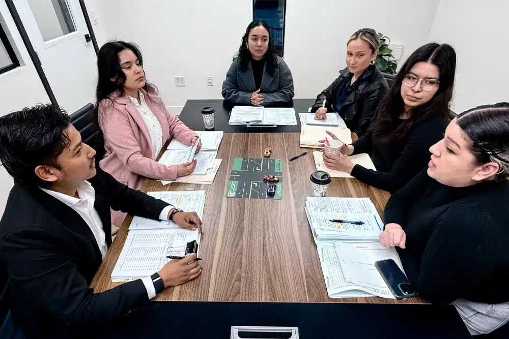 Bridgewater Law Group team meeting around a conference table